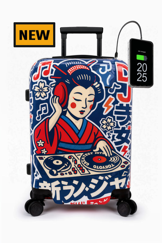 A hard-shell rolling suitcase with a colorful illustrated geisha DJ graphic on a blue background, shown on a white studio background. A black power bank is connected to the suitcase, and a yellow 'NEW' badge appears in the top left corner.