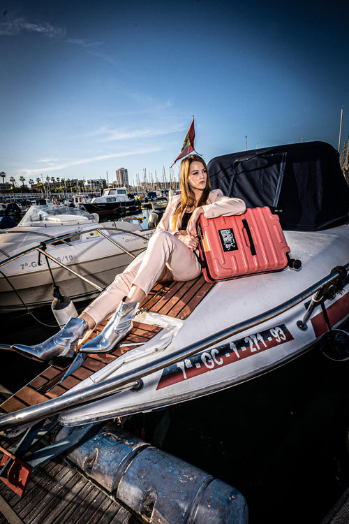 Girl using a Hand Cabin Luggage Antiscratch CORAL