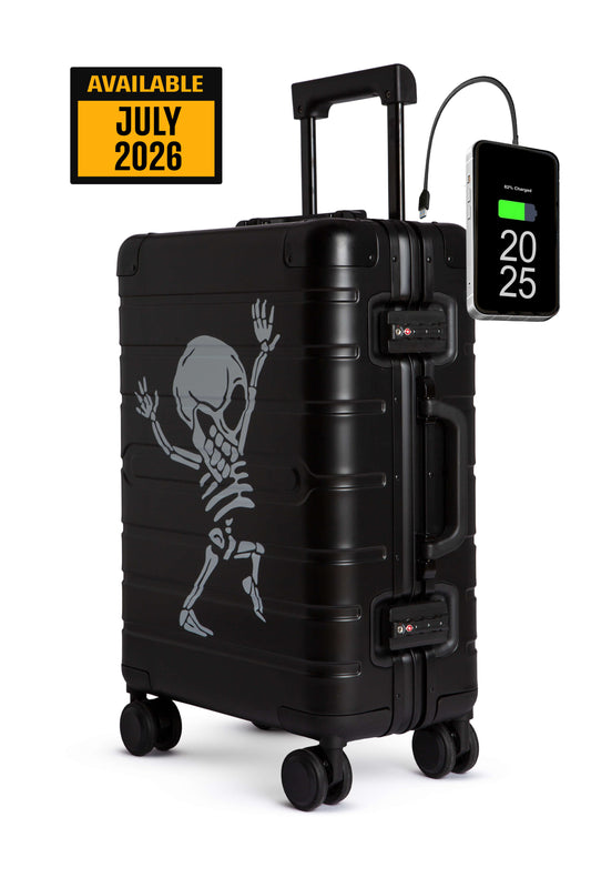 Black suitcase with skeleton design and digital display on a white background
