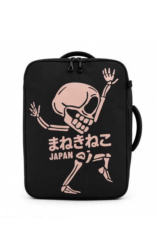 A black soft-sided rectangular bag with a pink cartoon skeleton dancing and Japanese text reading 'Makenkigo JAPAN' on the front, shown against a plain white background.