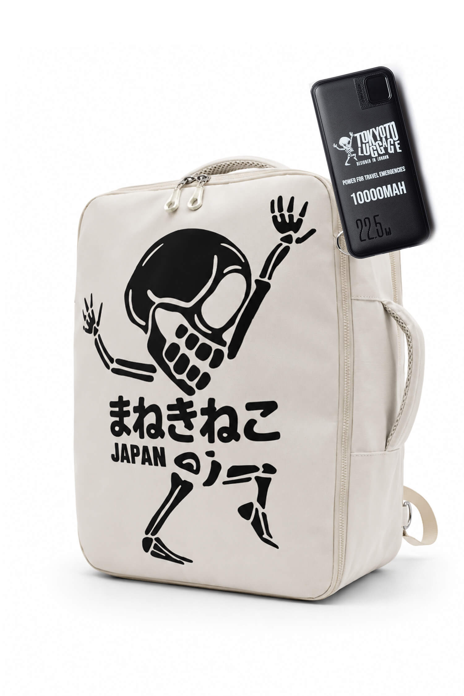 An off-white canvas backpack featuring a black graphic of a dancing skeleton with Japanese text and 'JAPAN' printed below. A black phone case with 'TRICK OR TREAT' and '1000MAH' branding is attached to the side of the bag.