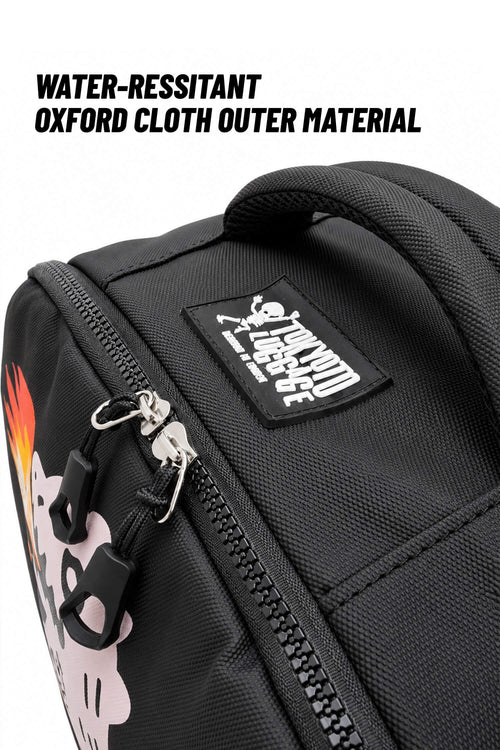 Close-up of a black backpack or bag with a top handle, zipper, and a sewn-on patch reading 'SKELETON LAZY'. Text at the top says 'WATER-RESSITANT OXFORD CLOTH OUTER MATERIAL'.